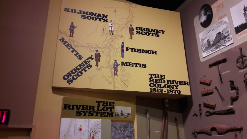 A map of the Red River Colony, showing the positions of Kildonan Scots, Orkney Scots, French and Métis. Right, a display of 19th century agricultural tools.